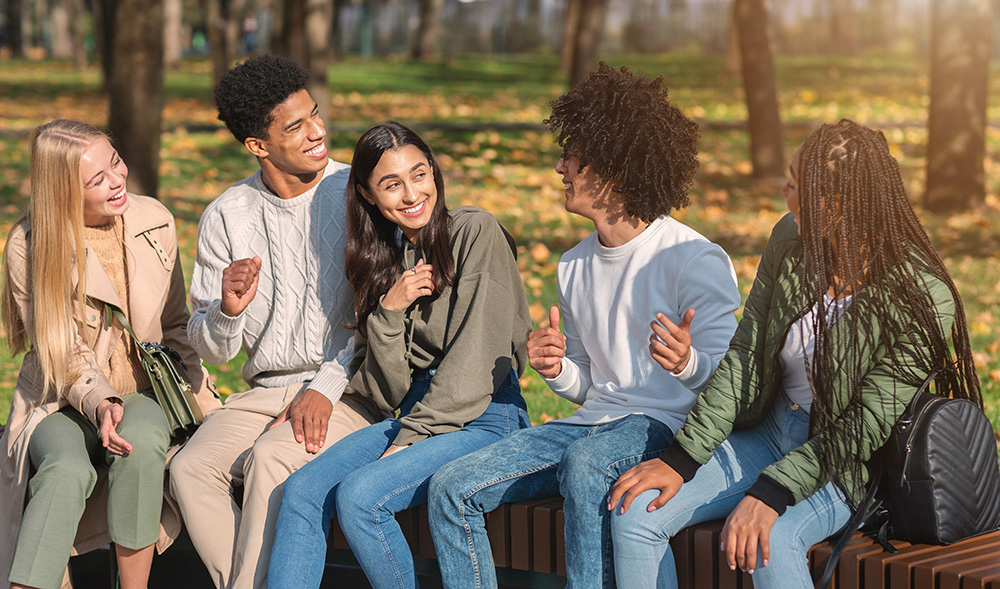 Teenagers talking in a park